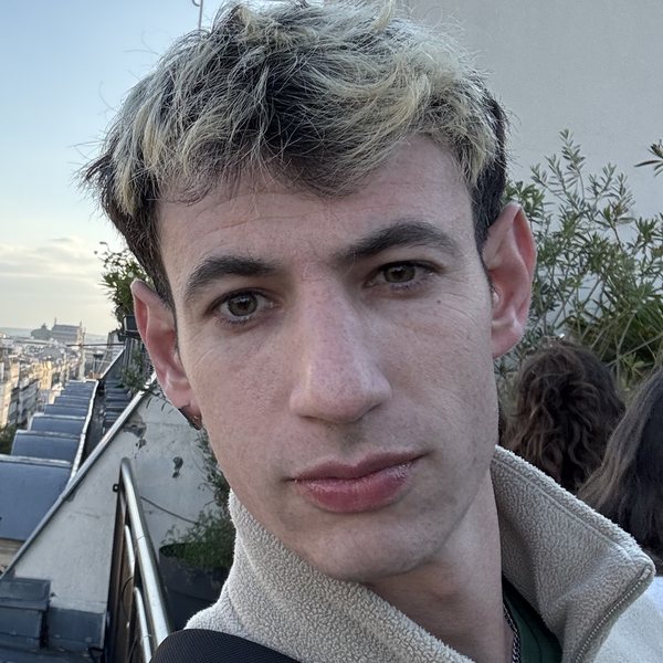 Assaf Shalin on a rooftop in Paris at dusk